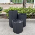 Stylish 42cm Fluted Pot, black finish, ribbed design, perfect for enhancing garden aesthetics.