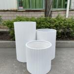 56 cm Fluted Pot, custom colour white , modern ribbed texture, suitable for various garden settings.