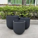 Lightweight and durable Fluted Garden Pots for indoor/outdoor use, crafted from glass-reinforced concrete. Perfect for a variety of plants, these pots add elegance to patios, balconies, and garden pathways.