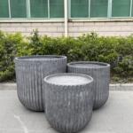 Fluted Garden Pots for indoor/outdoor use, available in 42 cm and 56 cm diameters, with a ribbed design. Ideal for clustering in groups of three to create a striking visual display in gardens or living areas.